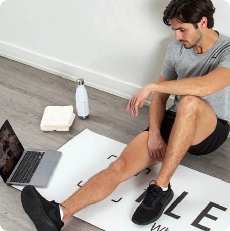 guy talking to his trainer on a laptop